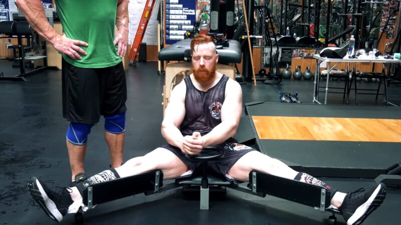 A Man Using the Century Versaflex 2.0 Stretching Machine