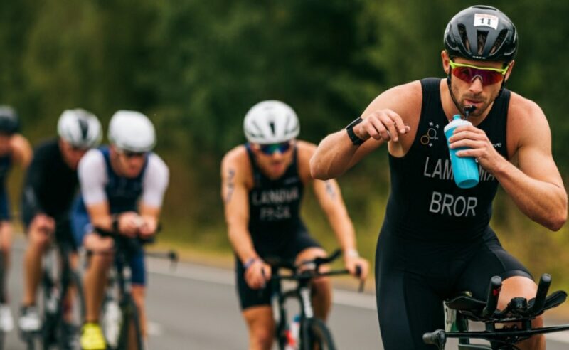 Cyclist drinks water during the race