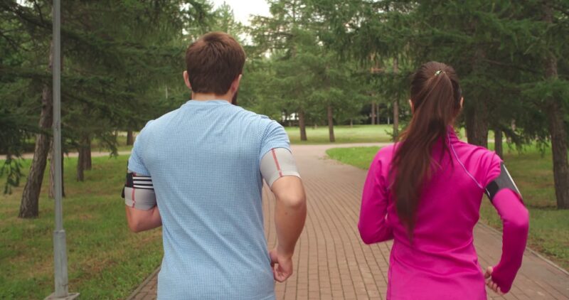 Couple running together at the park 