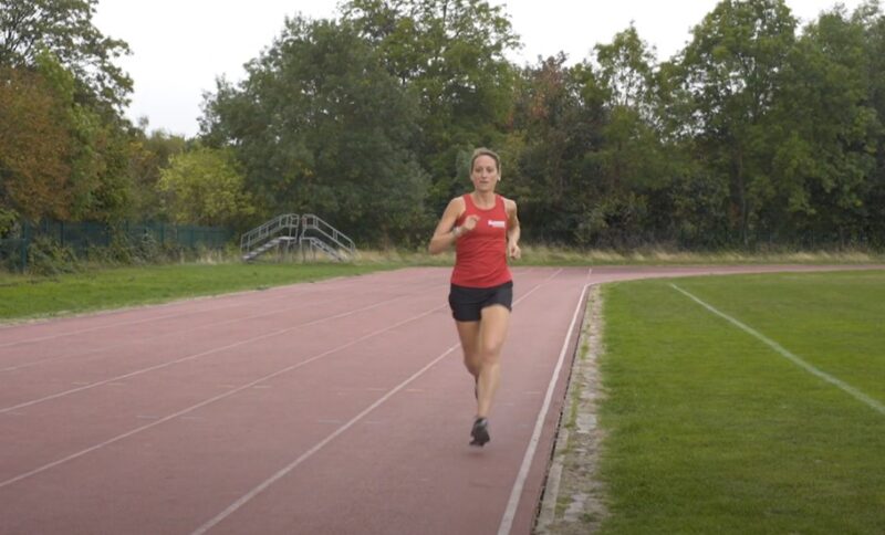 Woman running on a track