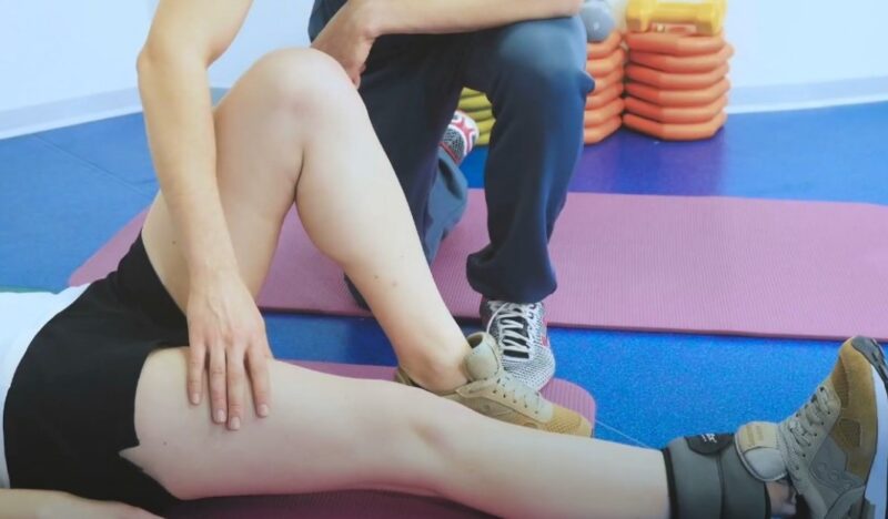 Woman with injured leg on a therapy