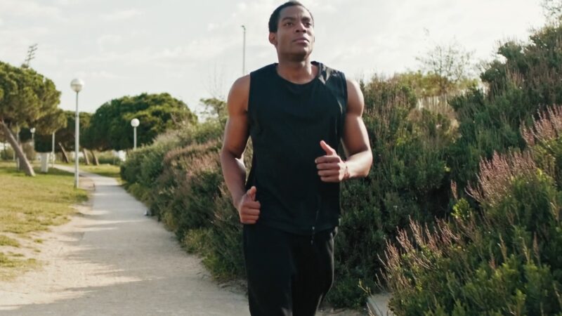 Man jogging on a paved path