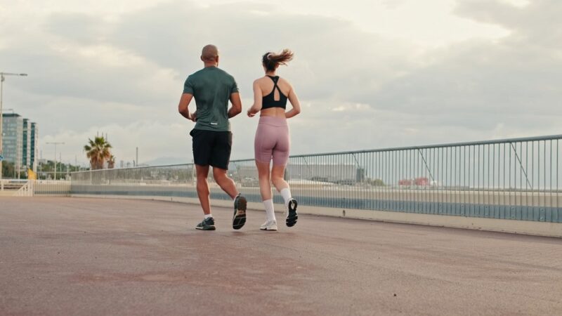 A man and a woman jogging in the morning