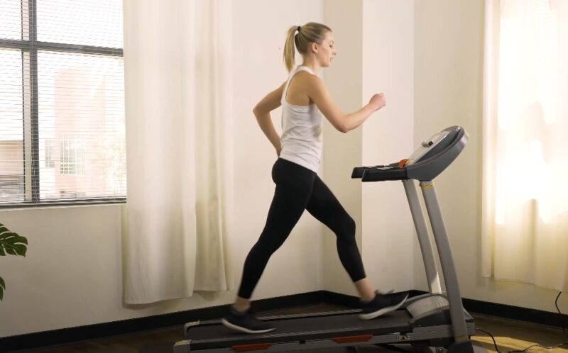 Woman walking on a treadmill