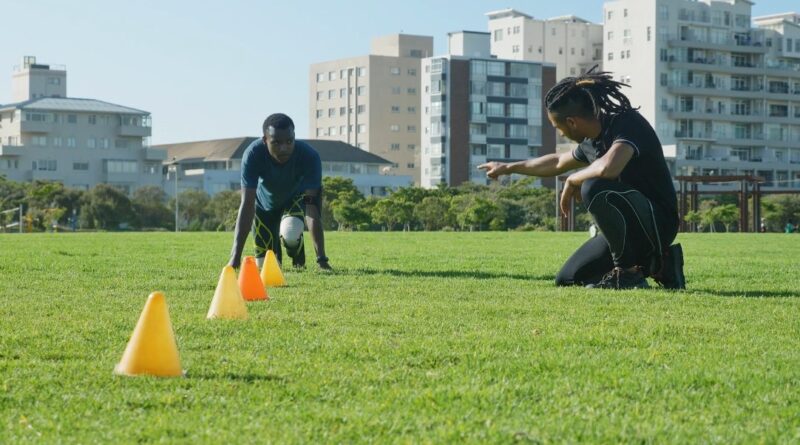 Athlete prepares for drills, guided by a coach