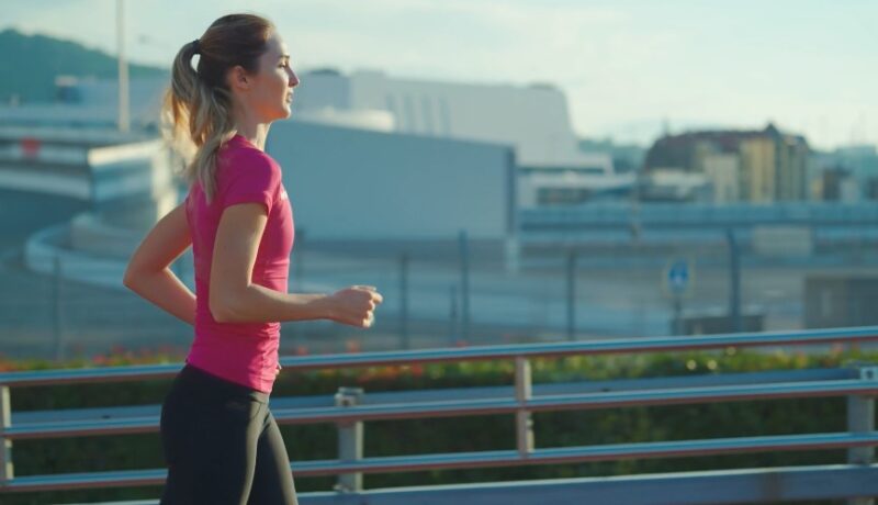 Woman jogging in urban landscape