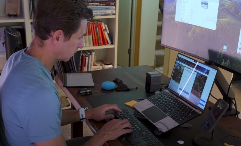 Online fitness coach working on a laptop
