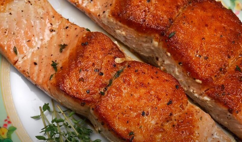 Perfectly seared salmon fillets, glistening with a flavorful crust