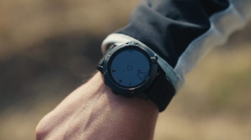 Close up view of a fitness watch on a man's hand