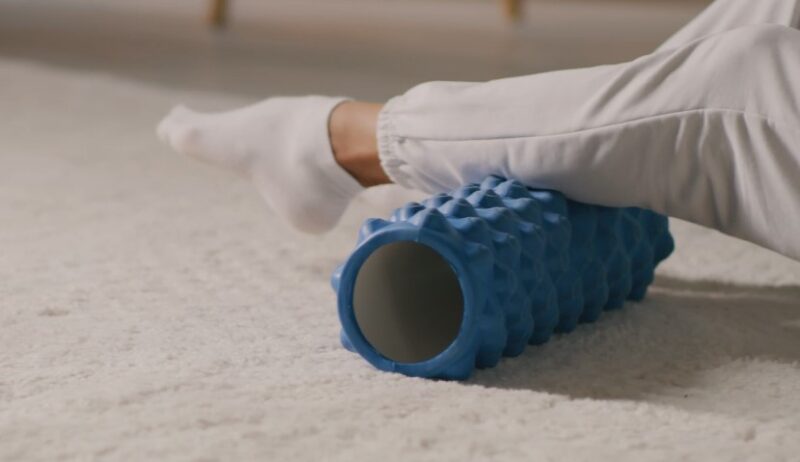 Leg positioned for myofascial release using a foam roller