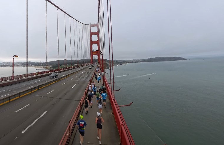 Runners traverse the Golden Gate Bridge, a testament to human endurance