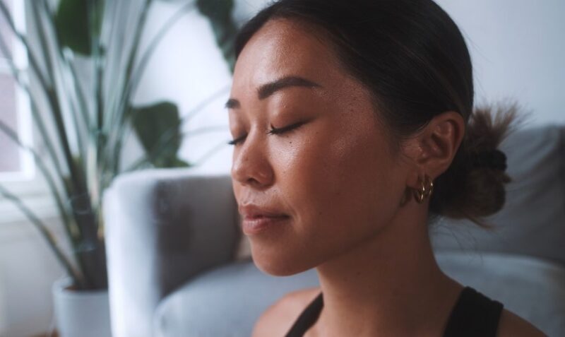 A woman finds inner peace in a tranquil moment
