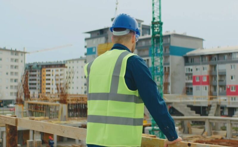 Construction worker surveys the site