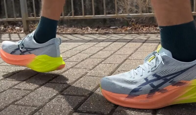 A runner's stride, highlighted by vibrant running shoes