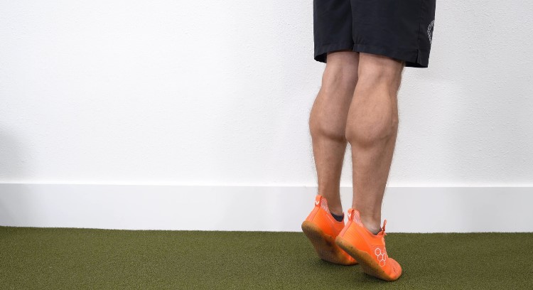 A man doing calf raises exercise