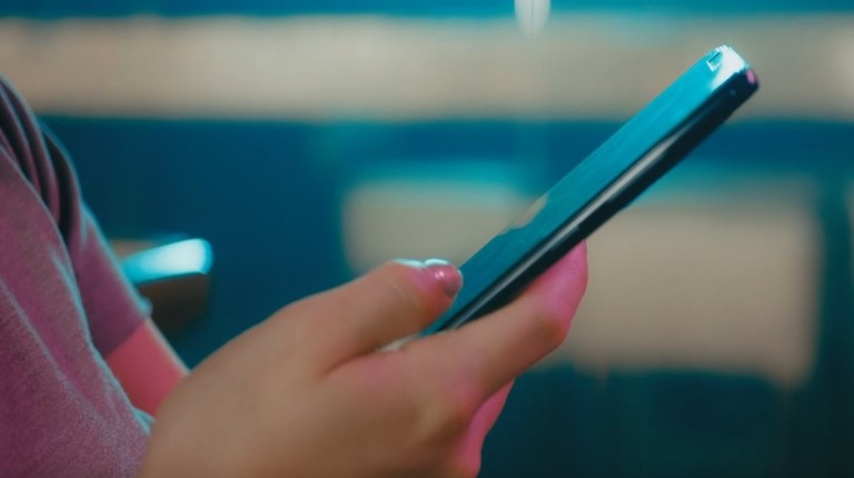 Close-up of a hand using a smartphone