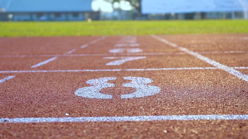 A running track shows numbered lanes ready for runners preparing to train for a race