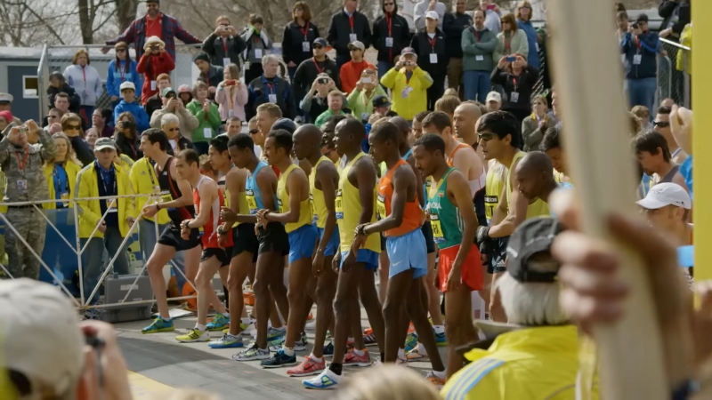 Elite runners stand at the starting line of a major race in Transcend, one of the top running documentaries