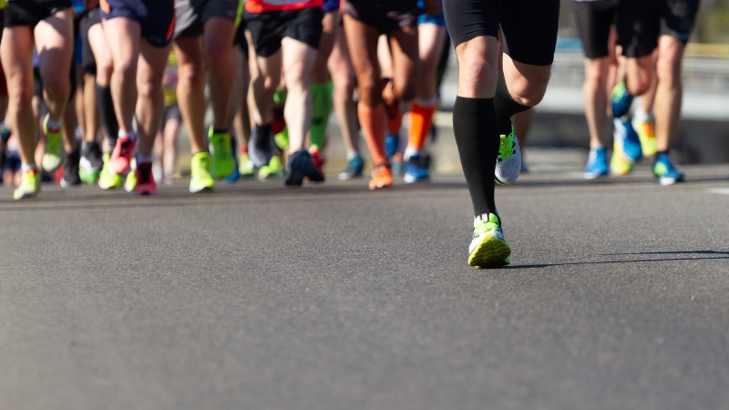 Runners in bright shoes starting their race