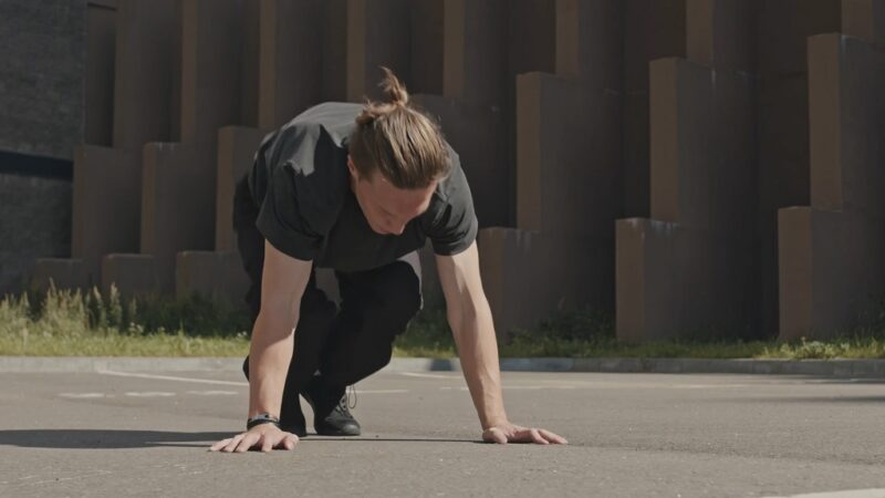 Athlete starting a high-intensity interval training (HIIT) workout with bodyweight moves