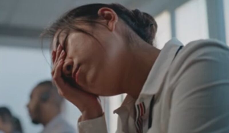 Woman feeling stressed on workplace
