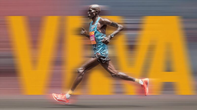 Runner in motion with āVMAā written in large blurred letters behind, symbolizing speed and endurance assessment