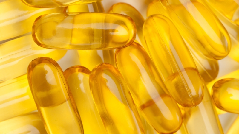 Yellow supplement capsules commonly used to support inflammation reduction